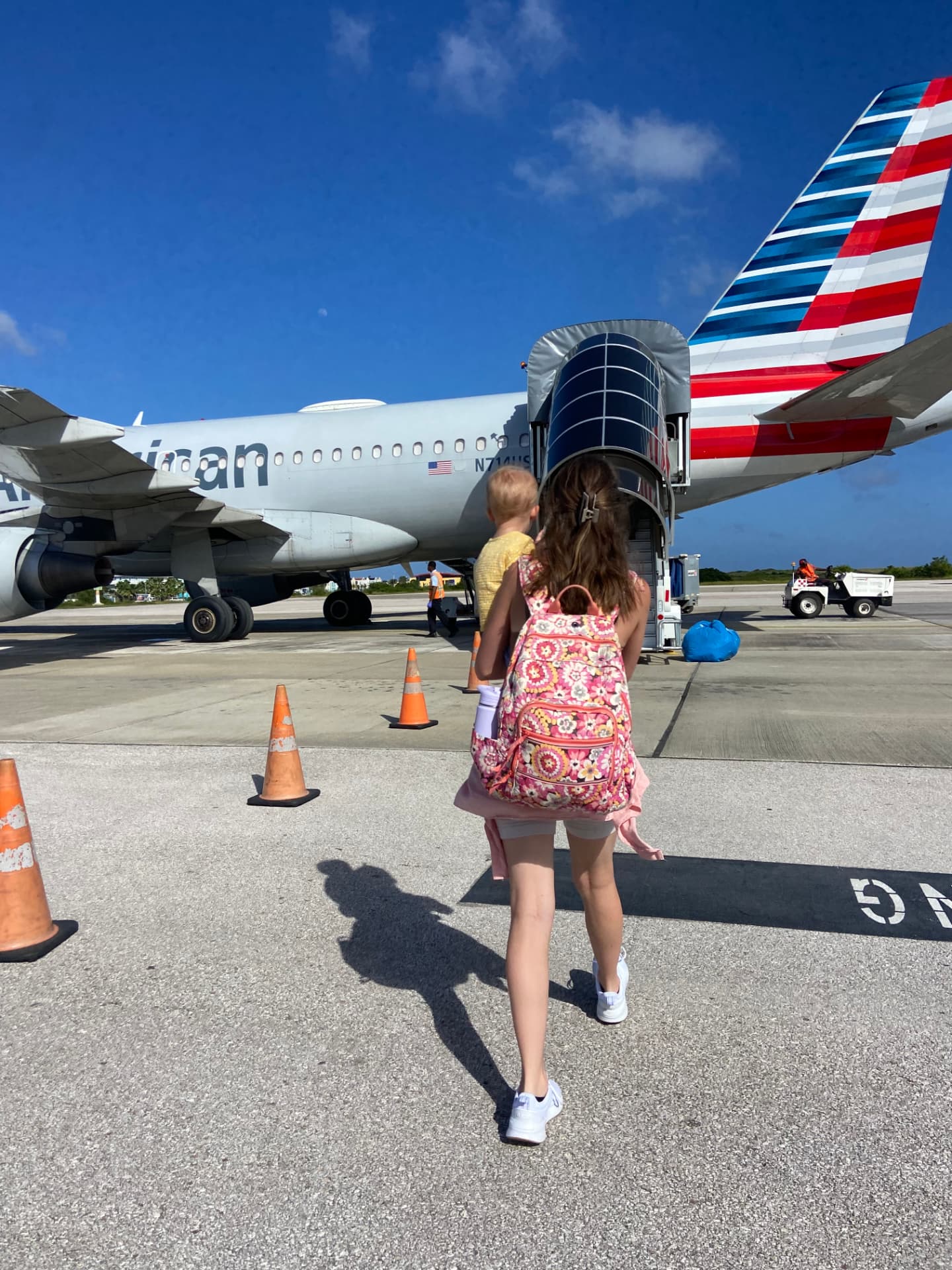 Joseph's family boarding an American Airlines plane on the tarmac